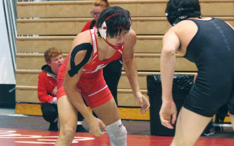 (Above) Hinton High School varsity wrestling senior Trenton Lusk looks to make his next move against an opponent on Dec. 6, 2019, at the Max Dippel Memorial wrestling tournament held at Weatherford High School. On March 30, it was announced that Lusk had made the 3A West 2020 All-Star Wrestling Team in the 152-pound weight class. ANDREW SALMI/HINTON RECORD