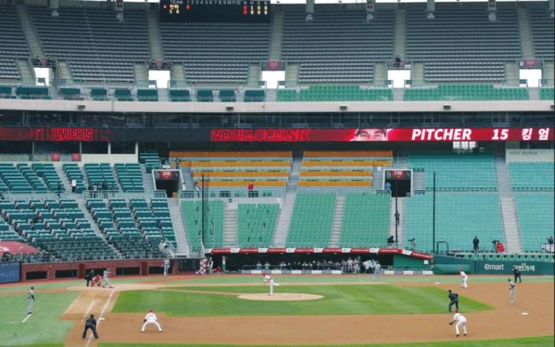 Stadium seats are empty as a part of precaution against the new coronavirus during a baseball game on May 5 between Hanwha Eagles and SK Wyverns in Incheon, South Korea. With umpires fitted with masks and cheerleaders dancing beneath vast rows of empty seats, a new baseball season got underway following a weeks-long delay from the coronavirus pandemic. Lee Jin-man AP Photo