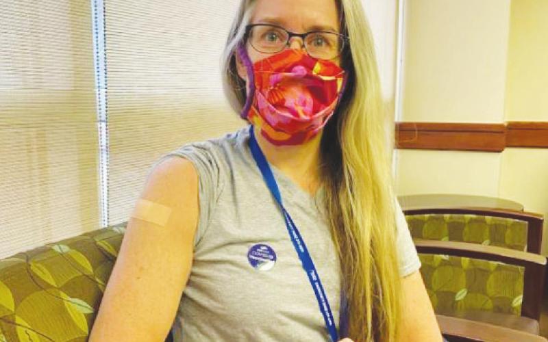OMRF physician-scientist Eliza Chakravarty, M.D., displays her bandaged arm following the second dose of her Covid-19 vaccine on Jan. 8, 2021.