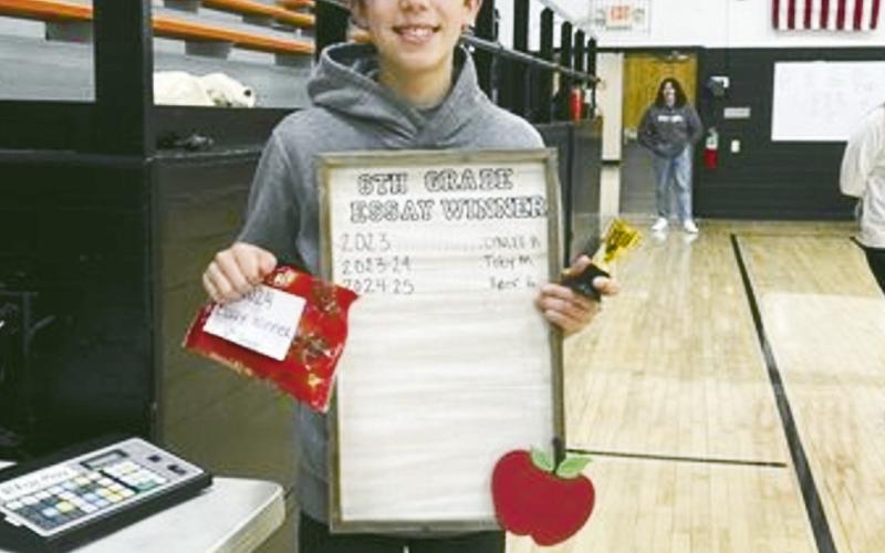 ABOVE RIGHT Ryder Garrett, winner of sixth grade essay contest.