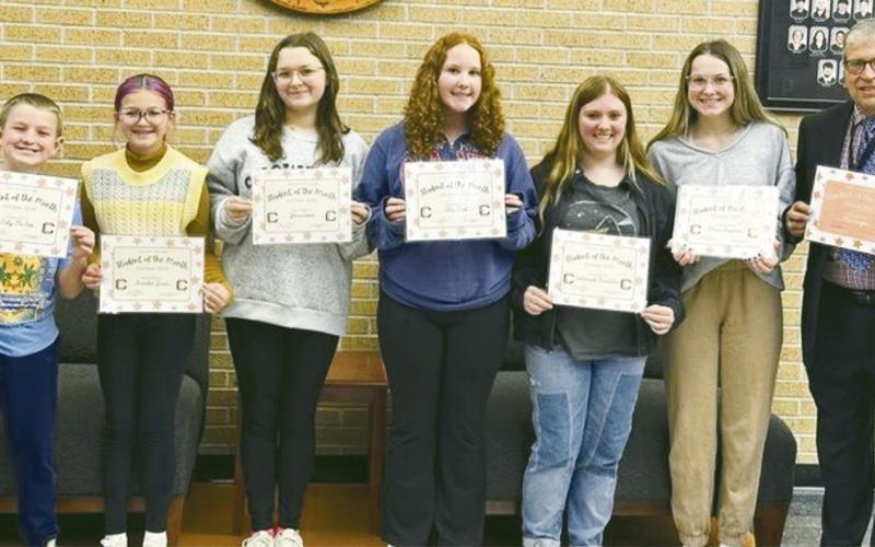 BELOW October spotlight winners. From the junior high are Johanna Bradshaw, Scarlett Jones and Toby McKee. From the high school are Josie Dean, Olivia Freyman and Alice Park. October spotlight shone on teacher Mr. Cooper.