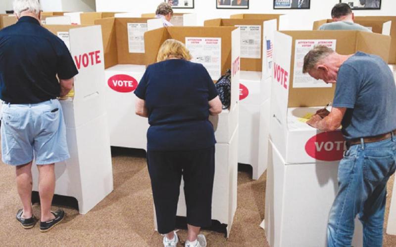 Voters are seen casting their ballots for the primary election at the St. James AME Church in Arcadia on June 28, 2022. (Whitney Bryen/Oklahoma Watch)