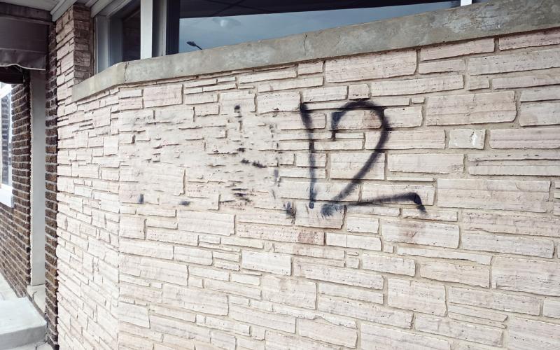 This wall on Noble Avenue was vandalised Friday night. Two persons have been arrested in connection with the spray paint, but other vandalism on the east side of town remains unsolved. The obscentity in this photo has been blurred for public consumption.