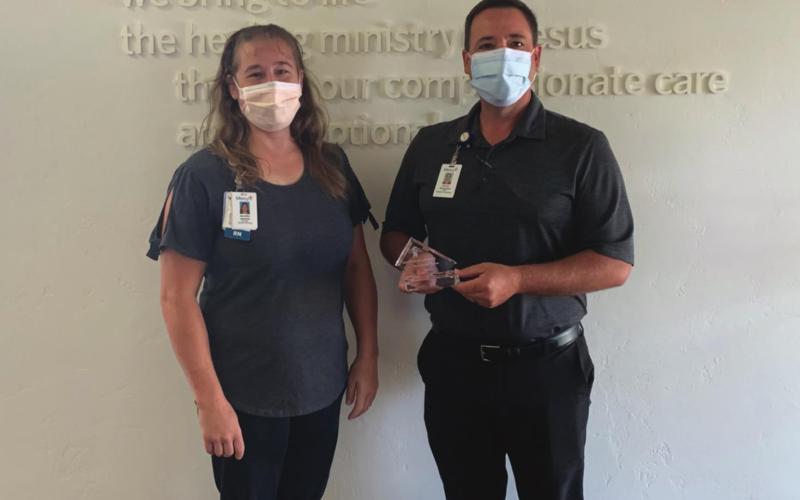 Jennifer Jackson and Kenny Thompson of Mercy Hospital accept an award for being Certified Healthy. (Photo provided by Taylor J. Shelton, Kingfisher County Health Department)
