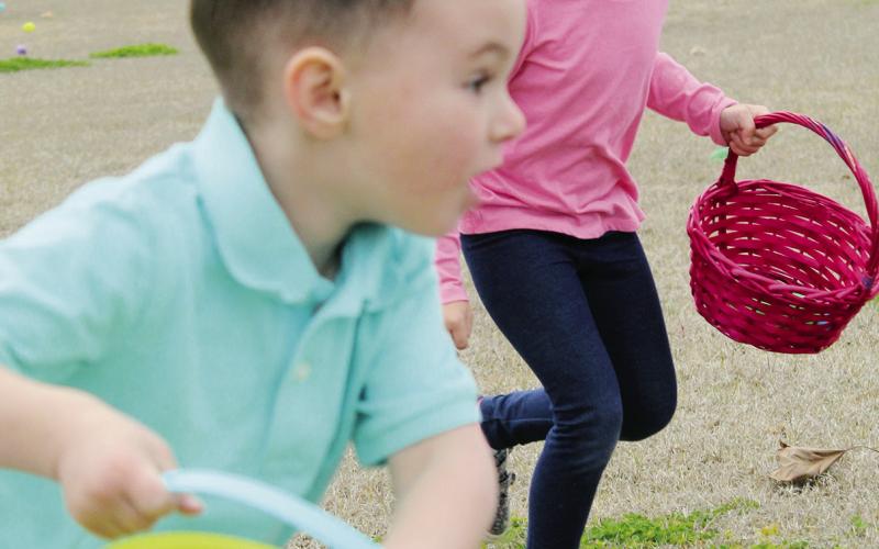 As soon as the horn sounded Saturday, youngsters raced toward the eggs scattered around the baseball fields at Huff Lorang Park in Watonga in the annual Kiwanis Easter Egg Hunt. The plastic eggs were filled with candy, and toys. Photo by Connie Burcham