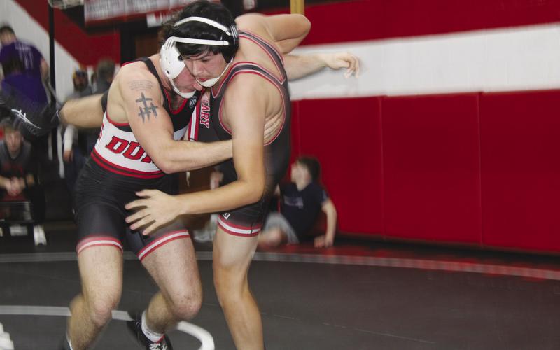 A Duncan wrestler puts a tough take down Friday on Geary’s Mark Perez.