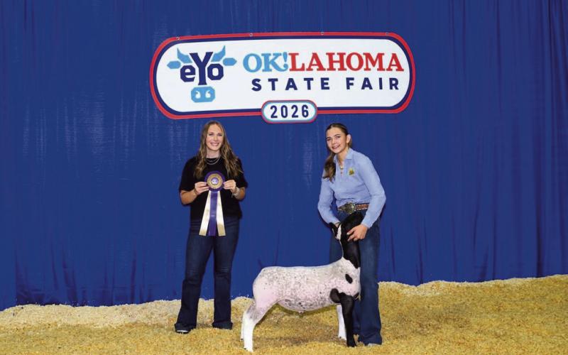 Mae Scheihing, an 8th grader at Watonga Middle School, and her grand champion hair sheep at the Oklahoma State Fair.