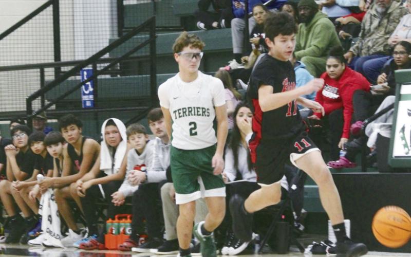 Basketball Falls to Thomas on the Road