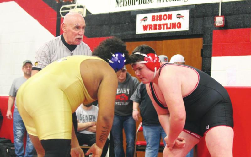 Tony Davidson (right) faces off against a wrestler in a match last year.