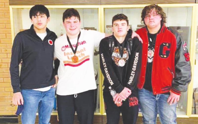 (From left to right) Marc Perez, Tony Davidson, Spencer Davidson and Chris Ward pose for a group photo after earning their medals. Photo provided by Geary High School