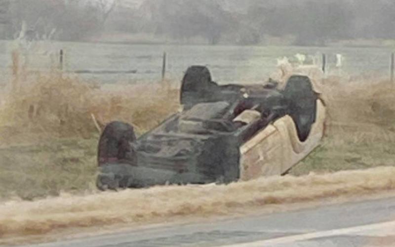 Right: Car flipped over in ditch after accident due to icy roads. (Photo provided by Reanna Goodnight)