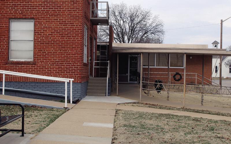 This photo shows the proximity of the old Watonga Hospital building and the Mercy Clinic, while the inset (Above, left) illustrates how close the two structures are. The city and Mercy are in discussions over the long term future of the properties, which the city owns and the medical facility leases. The small space betweenthe two could seriously impact the clinic structure in the event of the demolition of the old hospital.
