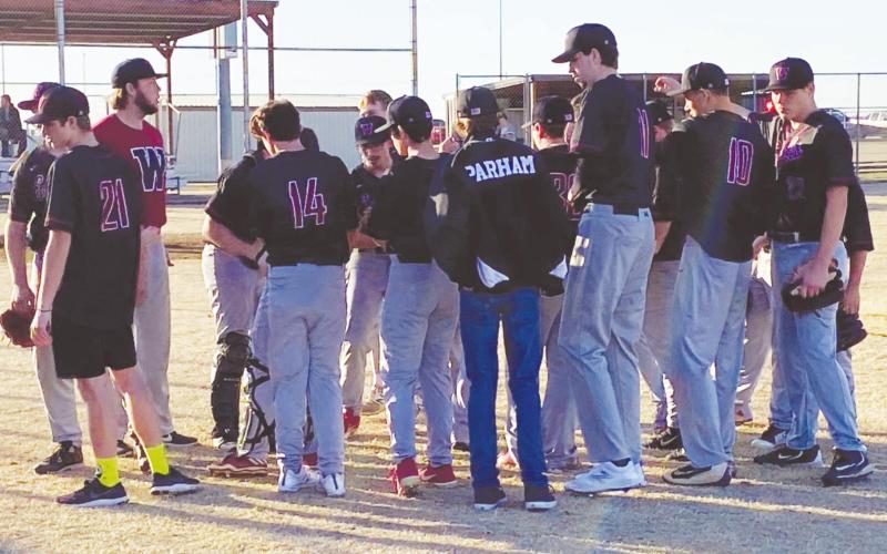 Andrew Salmi I Watonga Republican (Above) The Watonga High School varsity baseball team huddles together in between innings on Monday, March 2 during the Eagles’ season opener at home against Amber-Pocasset High School. The Eagles fell to the Panthers, 10-0.