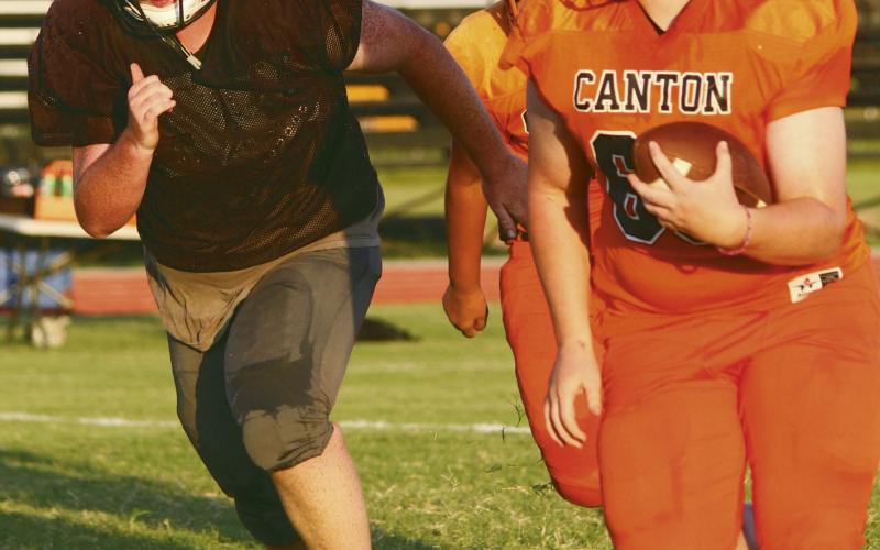 the Tigers managed to turn it into offensive gold and headed downfield (ABOVE RIGHT) The nets game is at 7 p.m. August 29 when the Canton Tigers take on the team from Garber at home. See ya there!