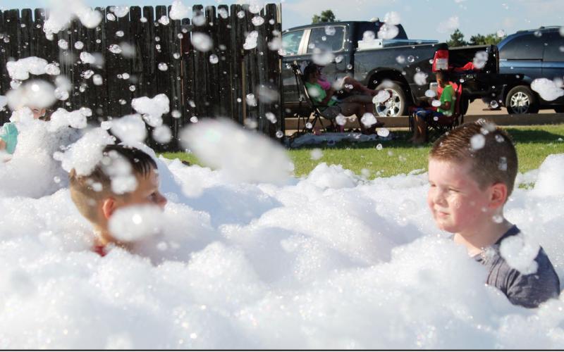 Kids of all ages had a blast Tuesday at the City of Watonga Independence Day celebration at Huff Lorang Park. There was a bubble machine, splash pad, bounce houes and fire trucknozzles going all at once, In addition to the band and all the hotdogs anyone could eat.