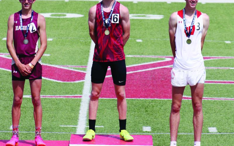 Brayden Cowan took the podium to claim his gold metal for the state championship in the 3200 meters.