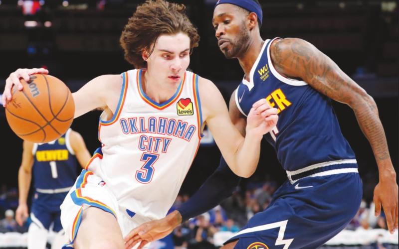 Oklahoma City Thunder guard Josh Giddey drives to the basket against Denver Nuggets forward Will Barton during the second half at Paycom Center. (Alonzo Adams-USA TODAY Sports)