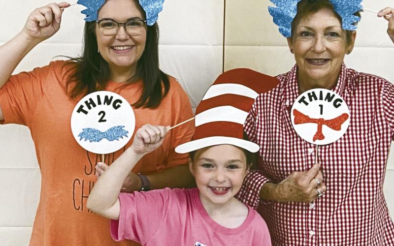 ABOVE AND BELOW LEFT AND RIGHT)Geary Elementary recently celebrated its literacy night. Forty families came to read, be read to, and take selfies complete with costumes and backdrops.