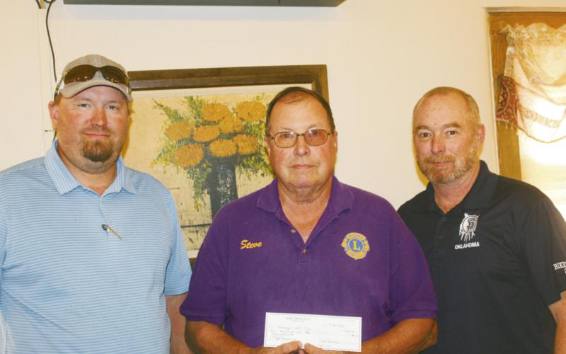 ABOVE: Kenneth Kunsman, production manager for SignalPeak Silica, Steve House of Watonga LIons Club and J.R. Hock, Singal Peak warehouse manager, display the check Signal Peak presented to the Lions for assisting in the September golf tournament to benefit local high school golfers.