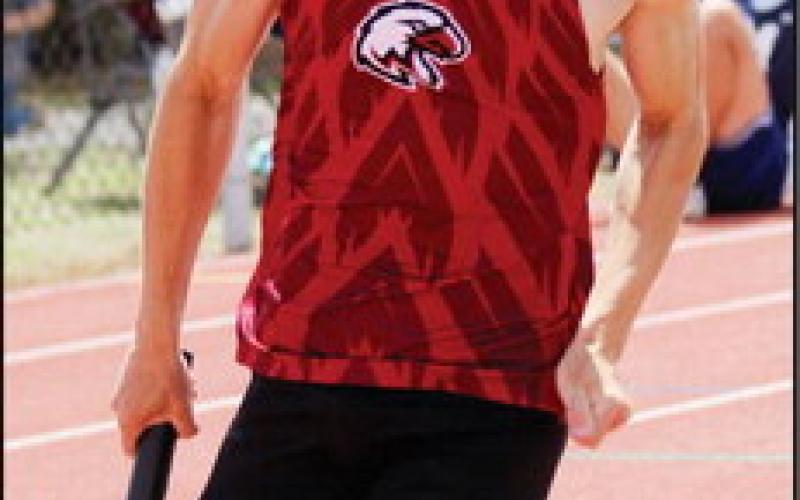 At Right Jackson Chapman hurls the discus for a distance of 95’. Below, Left Nick Walker in a relay race. Below, Right Izaiah Wilson in a leg of a relay race.