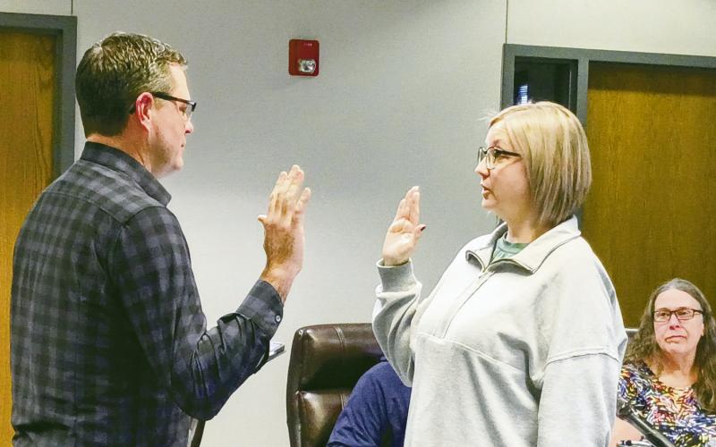 City attorney Jared Harrison (L) swears in Tara Bomhoff to serve the remainder of an unexpired term on the Watonga City Council.