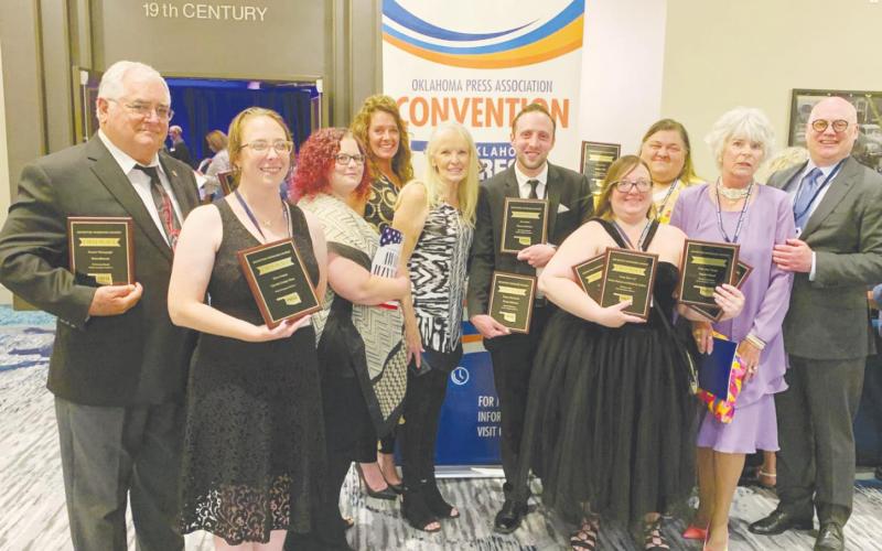 Wesner Publications employees pose with their awards following the Oklahoma Press Association convention on Saturday, June 12. Pictured above are (left to right) Brian and Kindra Blansett, Shirley Todd, Kimberly Jenkins, Angie Gentry, Graham Dudley, Tatiana Ryland, Shalene White, Zonelle Rainbolt and Brett Wesner.