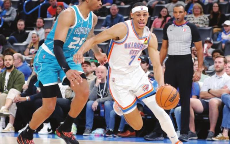 Oklahoma City Thunder forward Darius Bazley (7) drives to the basket as Charlotte Hornets forward P.J. Washington (25) defends during the second half at Paycom Center. Charlotte won 134-116. (Alonzo Adams-USA TODAY Sports)