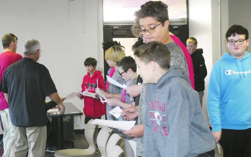 Seventh grade students at Watonga Middle School took part Tuesday in a mock election. Each student would approach the ‘poll workers’ and show their ID. Then they were given a mock ballot and sent to the voting booths. Along the way they were coached about the rules, such as not talking about who they were going to or had voted for inside the polling place.
