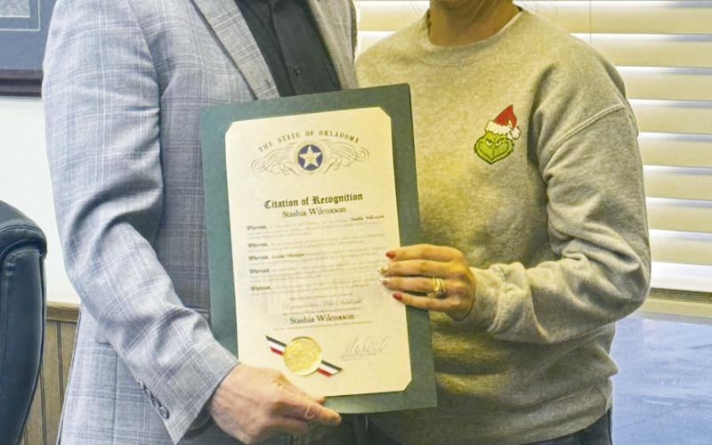 (ABOVE AND ABOVE RIGHT) Stashia WIlcoxson (L) and Stacey Walthers (R)with Representative Mike Dobrinski (R-Okeene) who is presenting them with