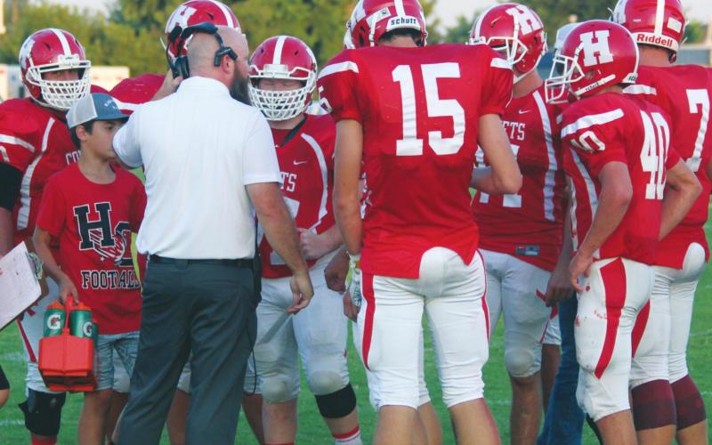 (Above) Hinton High School varsity football first-year head coach Grant Potter speaks with some of his players on Sept. 6, 2019 during a game vs. Mooreland High School. ANDREW SALMI/HINTON RECORD