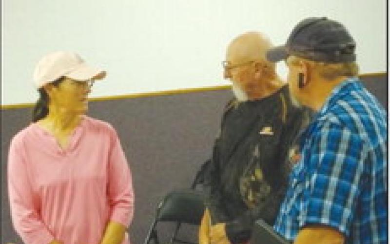 Jackie (L) and Jay Clark (C) are introduced as the new city emergency managers during a Geary Council meeting. They were brought on board by Jeff Choate (L) who is resigning as public works director for the city and is working to fill the jobs he will vacate later this month.