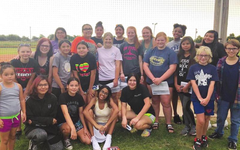 (Above) Players from both the high school and junior high Geary Lady Bison softball squads pose for a picture at the Geary Softball Field on Thursday, June 4 following the first player and parent softball meeting under first-year Lady Bison softball head coach Rick Scott. Photo Courtesy of Geary Public Schools The Geary Star
