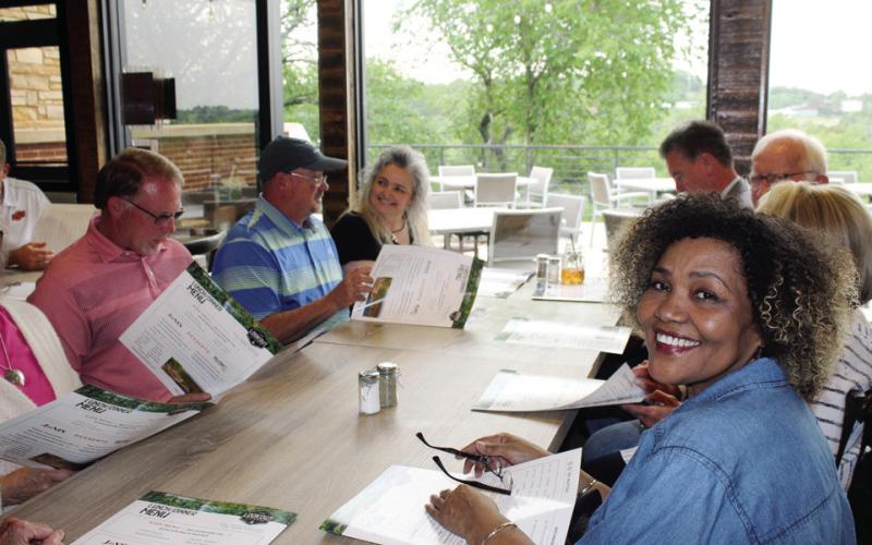 Members of Watonga City Council and the Oklahoma Legislature view the menu on opening day at the Lookout Kitchen at Roman Nose State Park, May 23, 2023