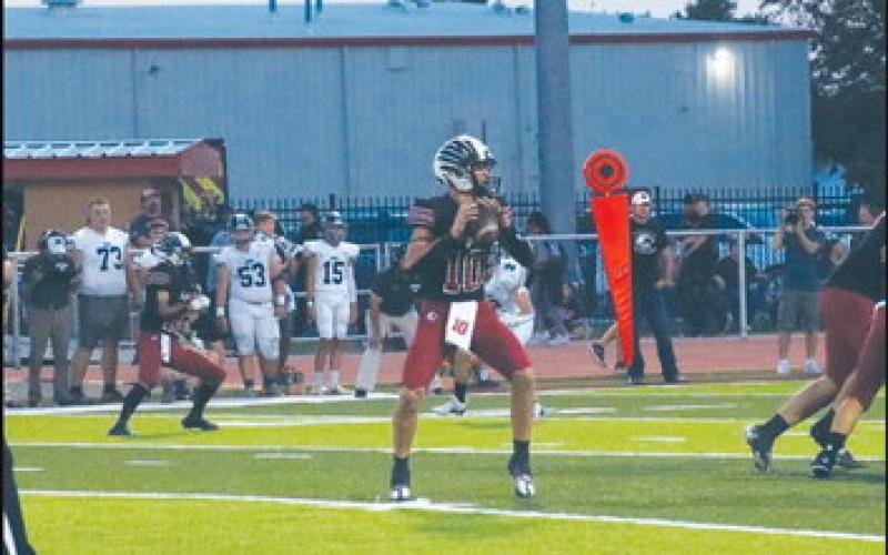 Quarter back Tristan Dobbins getting ready to make a pass.