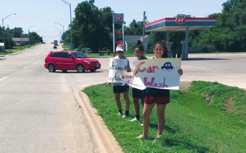 Lady Bison Softball Holds Car Wash Fundraiser