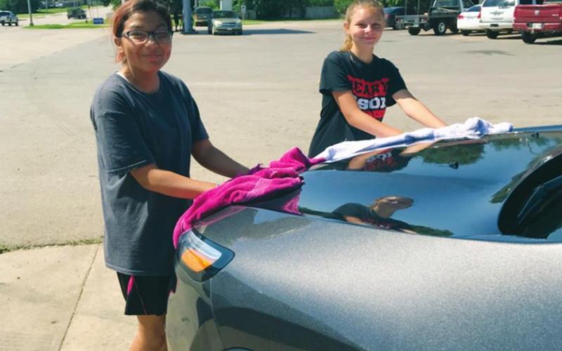 Lady Bison Softball Holds Car Wash Fundraiser