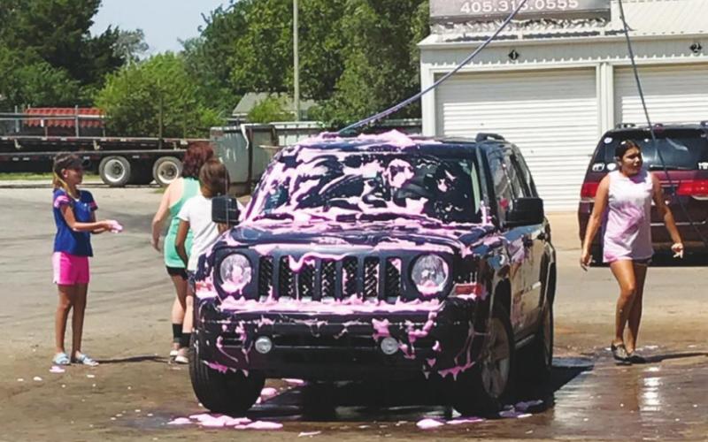 Lady Bison Softball Holds Car Wash Fundraiser