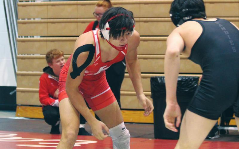 (Above) Hinton High School varsity wrestling senior Trenton Lusk looks to make his next move against an opponent on Dec. 6, 2019, at the Max Dippel Memorial wrestling tournament held at Weatherford High School. On March 30, it was announced that Lusk had made the 3A West 2020 All-Star Wrestling Team in the 152-pound weight class. ANDREW SALMI/HINTON RECORD