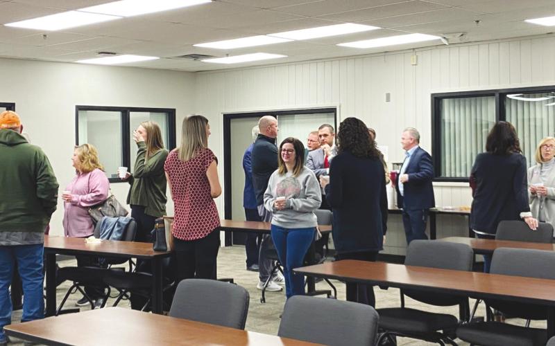 Locals mingle in the Watonga Middle School meeting room at the Watonga Chamber's Community Coffee event on Tuesday, Feb. 8. The school hosted the event on Election Day as the district sought approval for a $20 million bond to finance extensive new construction.