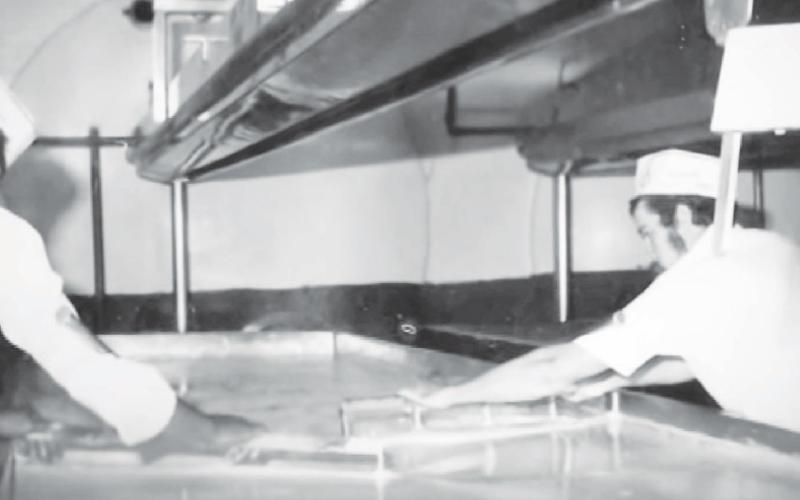 Workers prepare Watonga Cheese at the old Watonga Cheese Factory back in the 1970s.