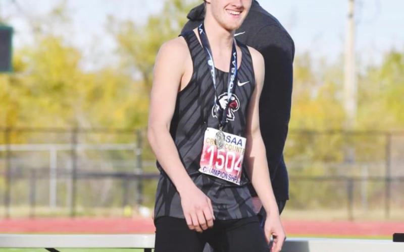 Cy Walters smiles after receiving his All-State medal. He finished seventh in the Class 2A state cross country championships.