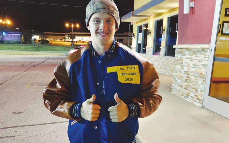 Cy Walters shows off his all-state lettermen’s jacket.