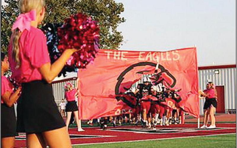 Watonga Eagle football players pour onto the field prior to Firday night’s game against Thomas-Fay-Custer. Photo Courtesy of Abbi’s Photography