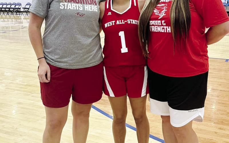 (AT LEFT)Malaki Perez represented Watonga at All State wrestling recently, while (AT RIGHT), Aubrey Bridges, with coaches Lauren Campos and Alyssa Fuxa, represented the Lady Eagles at basketball All State. BELOW - 72 elementary and middle school students showed up for skills and drills football camp.