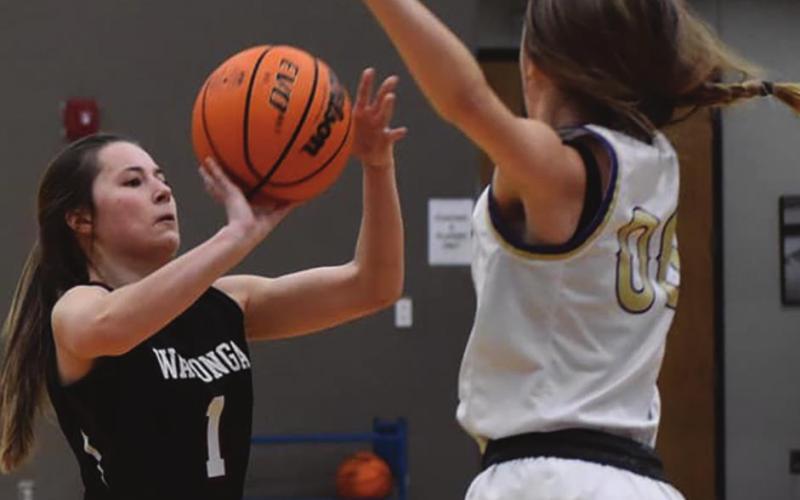 Lady Eagles player Abby Boeckman shoots over a Geary an Okarche player during her team’s tournament championship win in the Coyle Tournament. Brenda Geels | 3Watonga Republican
