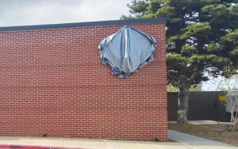 A Swadley's Foggy Bottom sign was covered up Monday at the Roman Nose Lodge after the after the Oklahoma Tourism and Recreation Department announced it was canceling the restaurant's lease at six parks across the state.