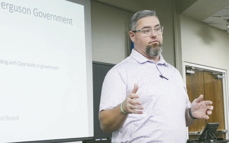 Garrett Bernethy, a member of the Hydro School Board, explains Friday to a group of area high school seniors what a board member does and why it is important to serve.