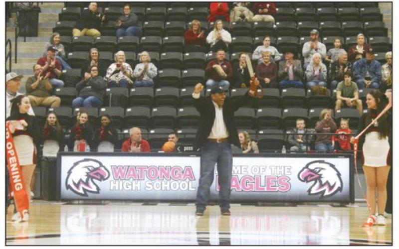 A big crowd was on hand Friday for the grand opening of the new gym at Watonga High School. District school board president Dwight McGee gives a victorious fist pump after cutting the ribbon held by cheerleaders Kylie Hilterbran( L) and Sydnee Lake.(R) PHOTO BY CONNIE BURCHAM