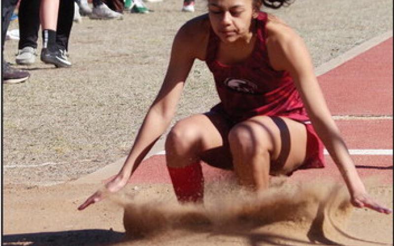 Above: Jayden Daukei sticks the landing after her long jump Photos By Connie Burcham