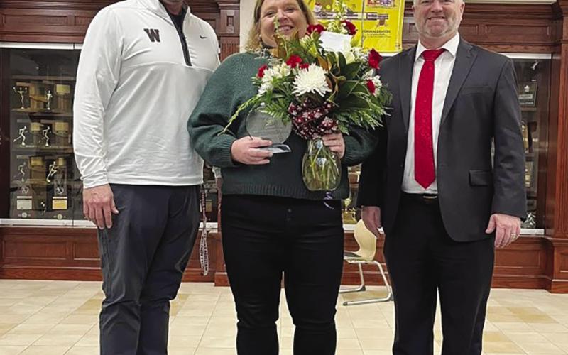 Carrie Compton was named Watonga Public Schools Teacher of the Year for 2022. Compton is shown with high school principal Todd Overstreet and Superintendent Kyle Hilterbran.